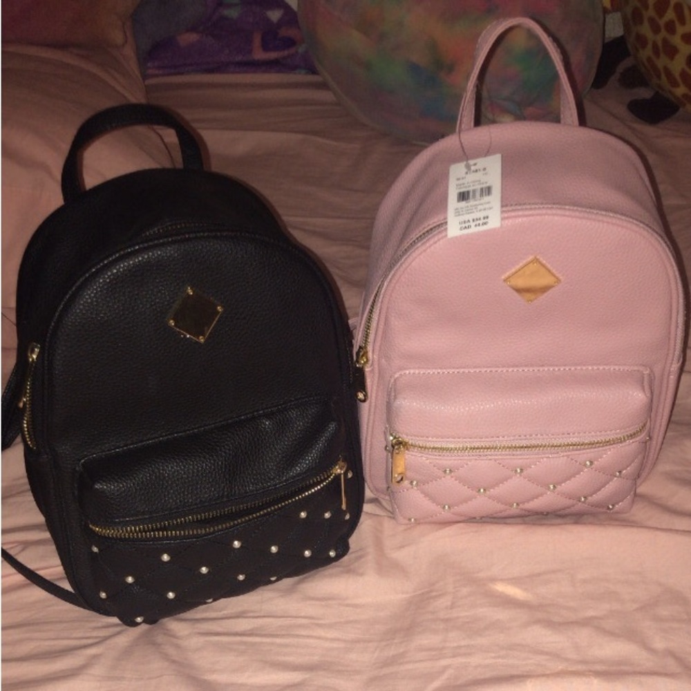 Claire’s faux leather/pearl mini backpacks
